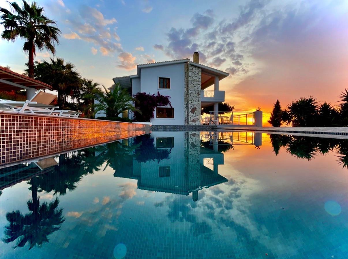 Infinity pool reflecting the sunset
